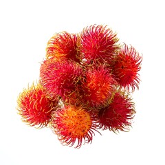 Cluster of rambutan fruits featuring vibrant red skins with soft green-yellow spines, showcasing a striking tropical appearance and natural texture.