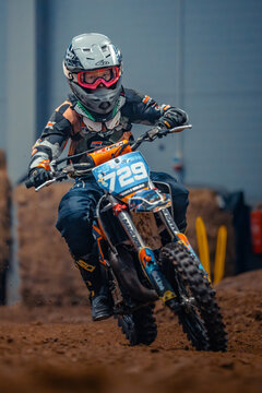Latvia, Riga, 2025-08-27, regular training. Motocross rider in action on a dirt track with number plate 729