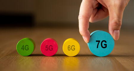 Hand placing 7g block showing communication technology progress