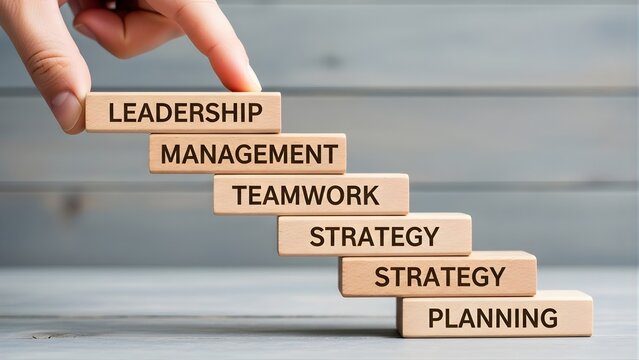 Hand stacking wooden blocks with business concepts