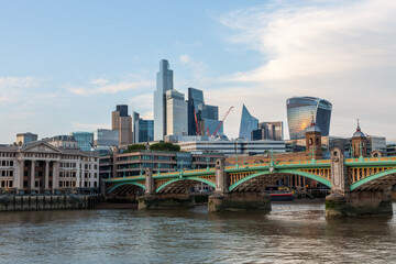 London skyline with Southwark Bridge over the River Thames in the city center.
