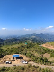 High angle panoramic view of tropical green mountain ranges