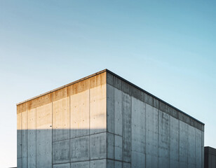 Fototapeta premium Industrial Corner Building Exterior with Copy Space for Construction and Factory Business Background