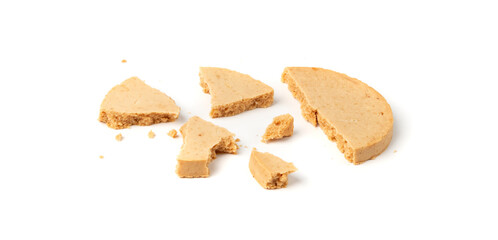 Protein cookie isolated, broken round energy snack with peanuts, chicory fibre