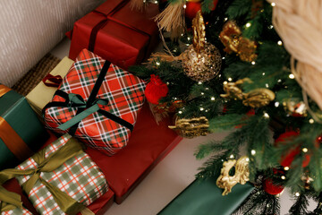 Christmas Tree with Wrapped Gifts and Festive Decor