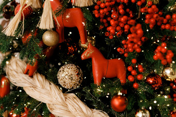 Elegant Christmas Tree Decorated with Red Berries and Ornaments