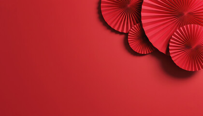 Premium minimalist red background for Chinese New Year with traditional paper fans decoration and copy space.
