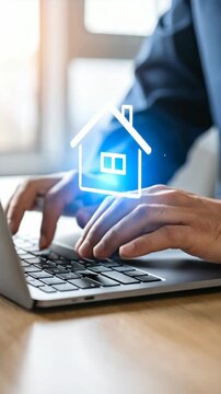 Close up of person typing on laptop with glowing house icon concept of searching for property