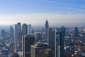 Obraz premium Aerial view from viewing platform of Main Tower platform with skyline and blue sky background on a sunny autumn day. Photo taken November 22nd, 2025, Frankfurt am Main, Germany.