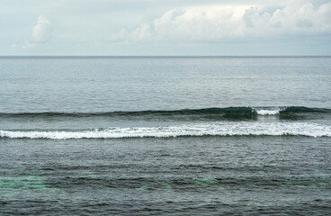 Fototapeta premium Lead-colored Indian Ocean in cloudy weather