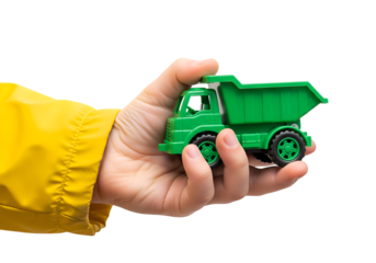 Kid hand with raincoat holding a green toy truck on transparent background
