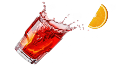 Fresh red drink splashing out of glass with orange slice