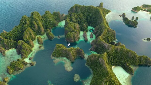 Raja Ampat, Indonesia: Aerial drone footage of the famous Piaynemo viewpoint plateform overlooking a stunning lagoon in the Fam islands in Raja Ampat in west Papua in Indonesia.