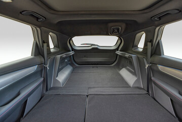 Trunk of car with rear seats folded, inside view