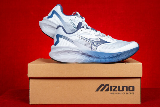 Zhongshan China-December 24 2025: pair of Mizuno white sporty shoes for man.