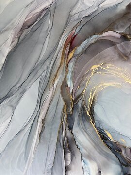 Abstract blue with gray hand made aquarelle background. Beautiful watercolor artwork made with gold and alcohol ink. Blue smoky fluid art texture resembles mist, blue marble, water, ocean, flow.