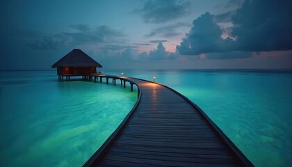 Wooden walkway leads to overwater bungalow over clear turquoise sea at dusk. Tropical island resort offers serene vacation view. Peaceful ocean landscape.
