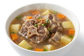 Indonesian sop buntut, oxtail soup with clear rich broth and visible fat droplets, tender meat, on a white plate with white background, suitable for food advertisement