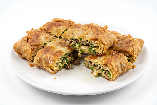 Indonesian martabak asin, whole round martabak telur cut into uneven pieces, on a white plate with white background, suitable for food advertisement