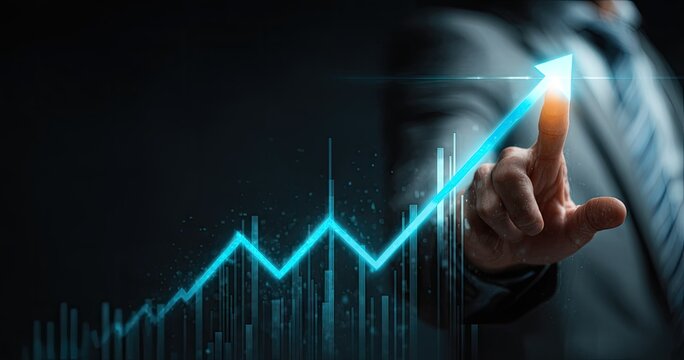Businessman points to growing graph representing business success and financial growth