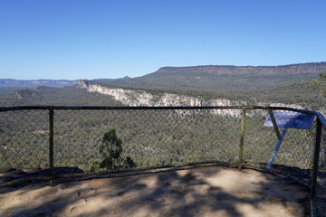 Scenic View of Australian Bushland from Rocky Cliff Edge under Clear Blue Sky