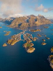 Vertical Aerial View of a Coastal Island Village Surrounded by Fjords and Mountains in Northern Norway