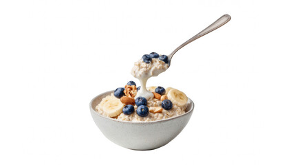 A healthy bowl of oatmeal with fresh blueberries, sliced bananas, and nuts