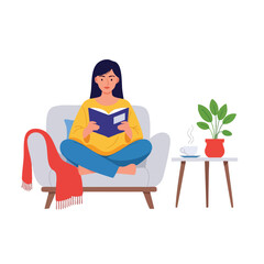 a woman is reading a book