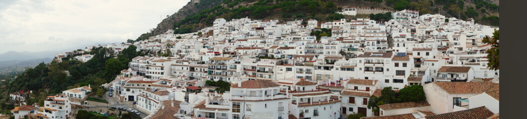 Panoramic view of Mijas (Andalusia), showing its whitewashed houses, terracotta roofs, hillside layout, and surrounding Mediterranean landscape, emphasizing the village&rsquo;s historic and scenic character