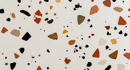 オレンジと黒のチップが散りばめられたテラゾー模様