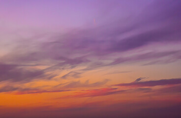 Vertical pastel sky gradient with soft yellow and blue tones