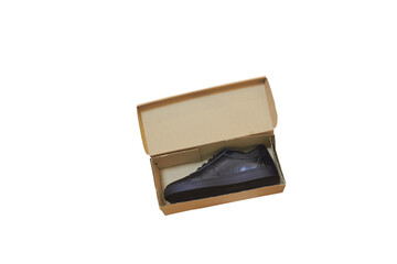 Leather shoe in a cardboard package isolated, New shoes in an open box on a white background