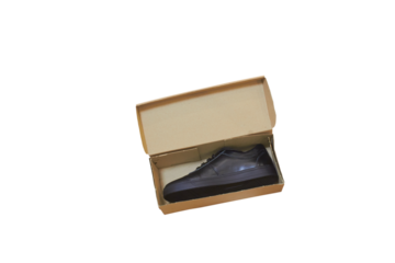 Leather shoe in a cardboard package isolated, New shoes in an open box on a white background