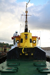 Fototapeta premium Barge dredging platform crane barge tug boat on the sea 