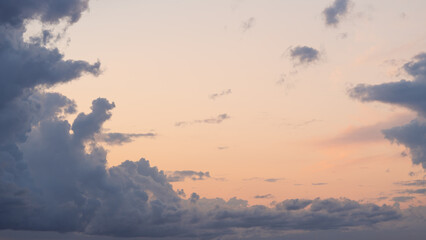 Evening clouds in the sky in summer evening with warm light