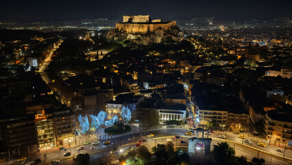 Aerial drone night shot of illuminated iconic Acropolis hill and the Parthenon during Christmas , Athens historic centre, Attica, Greece