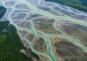 Intricate pattern of water channels and sediment deposits in a pristine, expansive natural delta landscape viewed from above, conservation, wilderness, flow