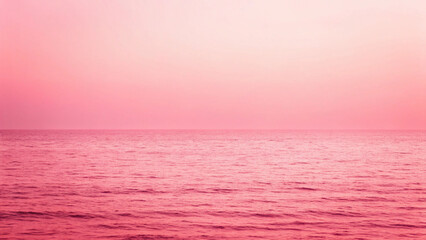 Obraz premium Calm Pink Ocean Water with Gentle Waves Under a Soft Pink Gradient Sky image photo Background