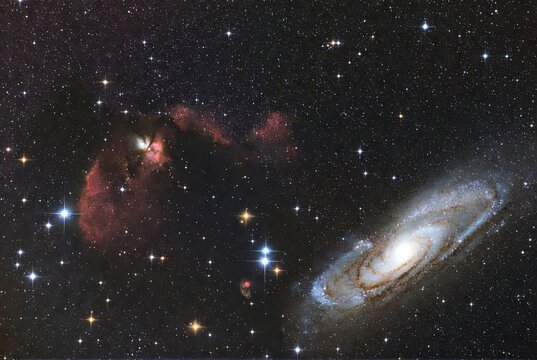 Majestic spiral galaxy and vibrant emission nebulae against a star-dusted cosmic&hellip;