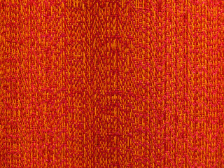 Obraz premium Closeup of orange fabric cloth swatch for use as a background texture