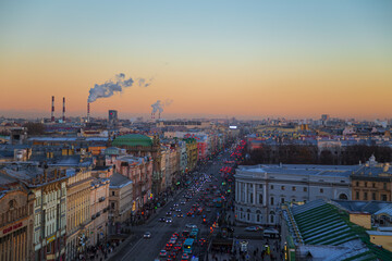 View of the festively decorated Nevsky Prospect from the Duma Tower. Beautiful sunset.