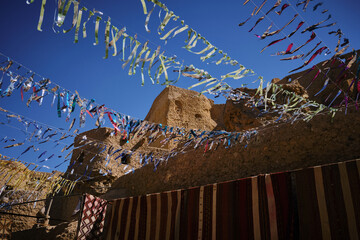 Traditional berber carpets and street decorations on the souk in Shali fortress. Street bazaar at Siwa oasis, Sahara desert, Egypt