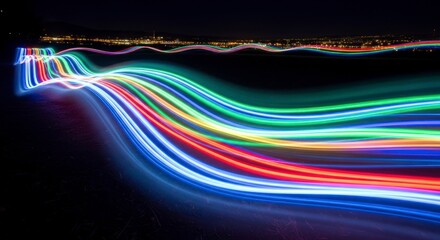 Colorful light trails on black.