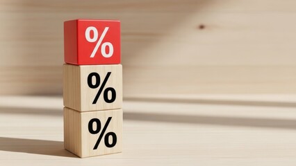 Stacked wooden and red blocks show percentage symbols on light wood surface.