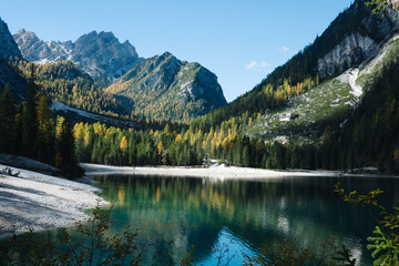 Mountain Lake Scene - Lago di Braies Italy Dolomites, Emerald green lake with mountains, alpine trees and alps landscapes - jigsaw puzzle and chocolate box perfect - sunny autumn fall day