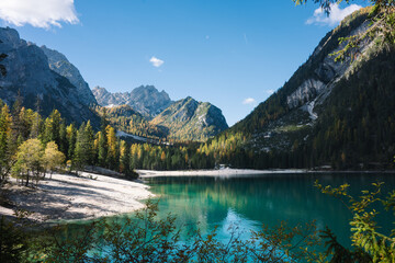 Mountain Lake Scene - Lago di Braies Italy Dolomites, Emerald green lake with mountains, alpine trees and alps landscapes - jigsaw puzzle and chocolate box perfect - sunny autumn fall day