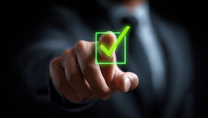 Finger touching glowing green checkmark on dark background