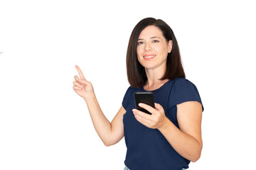 Smiling woman holding a smartphone and pointing with her index finger at ample copy space, presenting new technology, mobile apps, or digital advertising concepts on a white background