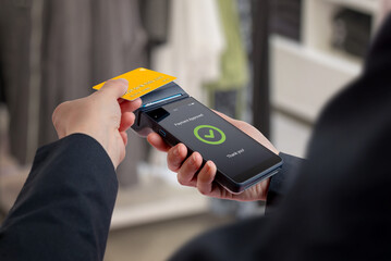 Approved payment confirmation displayed on POS terminal after card transaction, symbolizing secure authorization, identity verification, trust, and protected financial operations