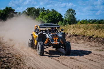 ATV, UTV, buggy, rally riding in dusty track. Amateur competitions